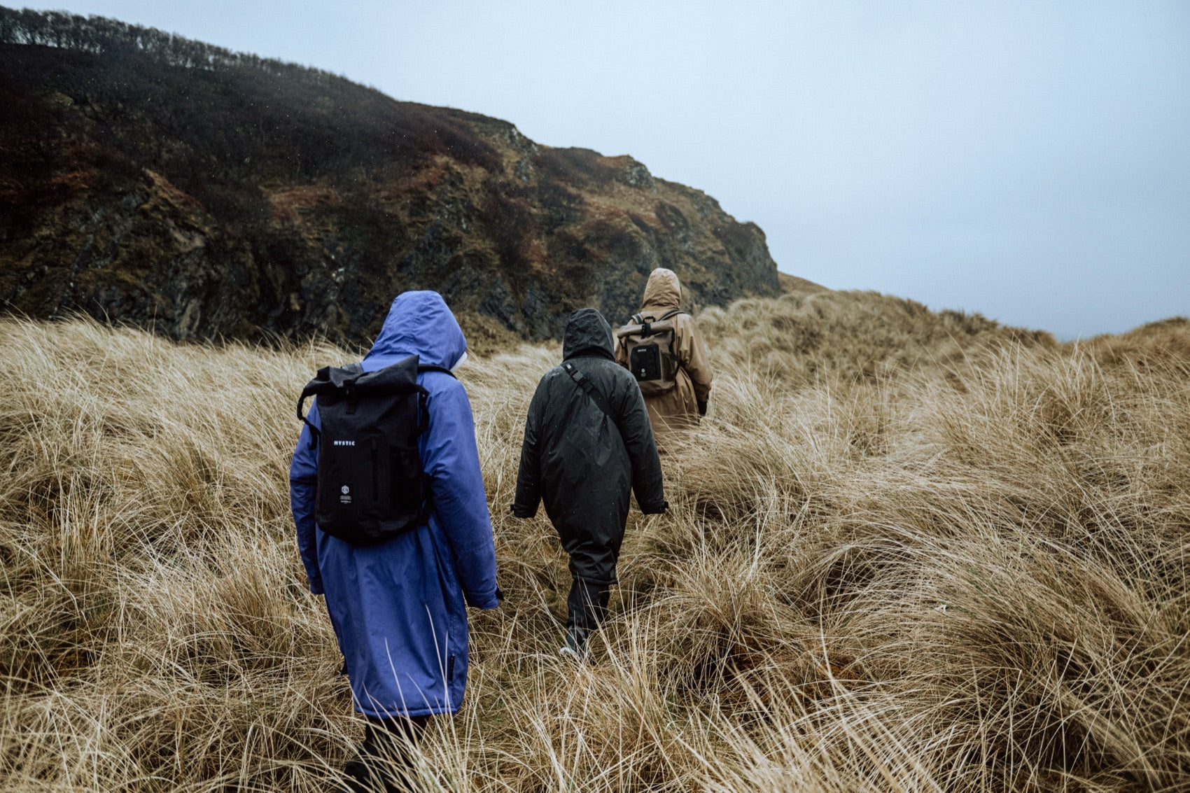 Crew hiking a remote coastal route